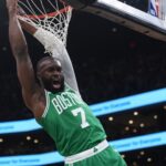 Mar 18, 2026; Boston, Massachusetts, USA; Boston Celtics guard Jaylen Brown (7) makes the basket against the Golden State Warriors in the first quarter at TD Garden