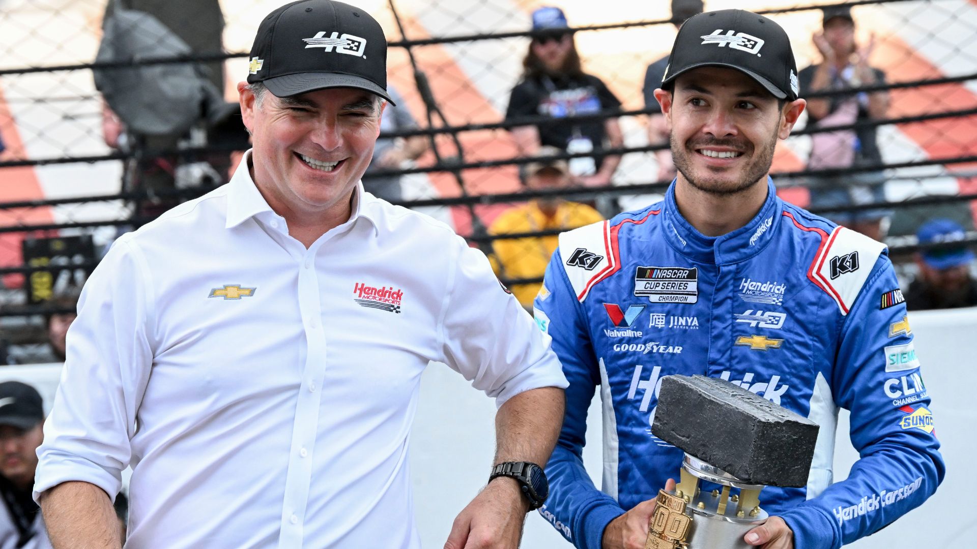 Jeff Gordon celebrates with NASCAR Cup Series driver Kyle Larson (5) after he won the Brickyard 400, Sunday, July 21, 2024, at Indianapolis Motor Speedway.