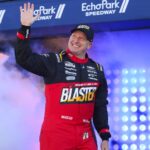 Feb 22, 2026; Hampton, Georgia, USA; NASCAR Cup Series driver Michael McDowell waves during introductions at EchoPark Speedway.