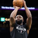 Boston Celtics forward Jaylen Brown (7) warms up before playing against the Philadelphia 76ers at TD Garden.