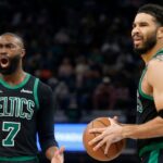 Boston Celtics guard Jaylen Brown (7) and forward Jayson Tatum (0) react during the third quarter against the Memphis Grizzliesat FedExForum