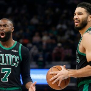 Boston Celtics guard Jaylen Brown (7) and forward Jayson Tatum (0) react during the third quarter against the Memphis Grizzliesat FedExForum
