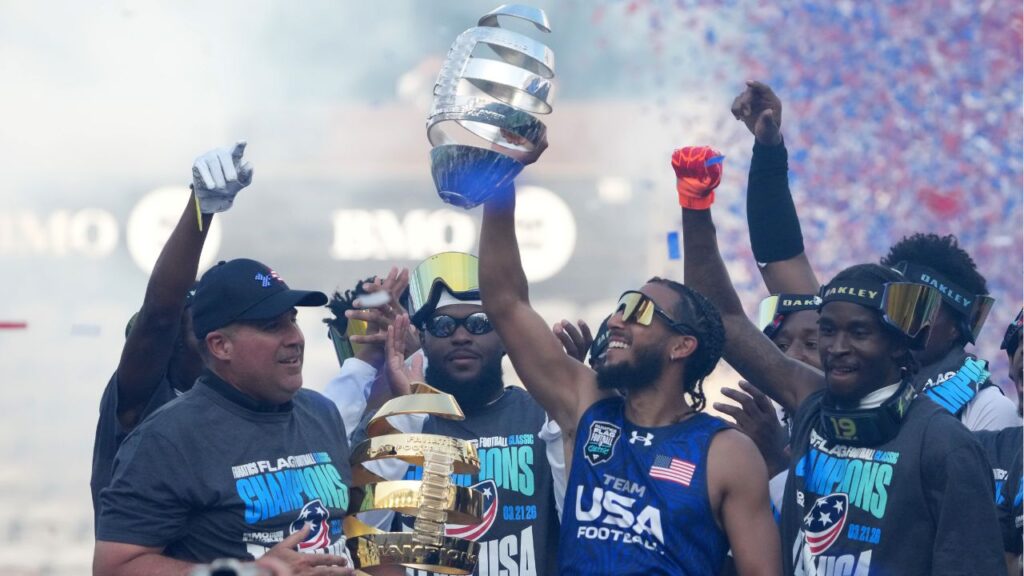 Team USA hoisting the trophy after defeating NFL stars at the Fanatics Flag Football Classic
