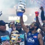 Team USA hoisting the trophy after defeating NFL stars at the Fanatics Flag Football Classic