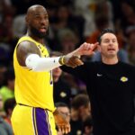Los Angeles Lakers forward LeBron James (23) and head coach JJ Redick against the Phoenix Suns at Mortgage Matchup Center