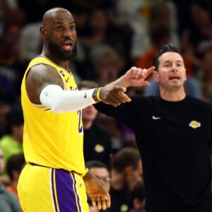 Los Angeles Lakers forward LeBron James (23) and head coach JJ Redick against the Phoenix Suns at Mortgage Matchup Center