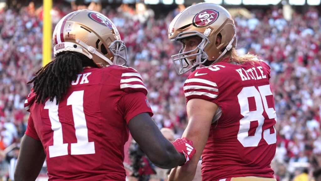 San Francisco 49ers tight end George Kittle (85) celebrates with wide receiver Brandon Aiyuk (11) after scoring a touchdown against the Dallas Cowboys during the first quarter at Levi's Stadium.