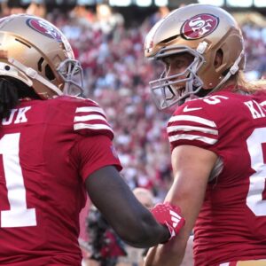 San Francisco 49ers tight end George Kittle (85) celebrates with wide receiver Brandon Aiyuk (11) after scoring a touchdown against the Dallas Cowboys during the first quarter at Levi's Stadium.