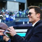 Tom Brady signs autographs before the 2026 NFC Championship Game between the Seattle Seahawks and the Los Angeles Rams at Lumen Field.