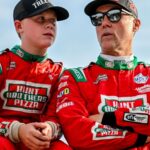 Former NASCAR Cup Series champion Kevin Harvick, center, right, and his son Keelan, 13, look on before the two raced in the 13th annual Masters of the Pros 200 race on Wednesday,