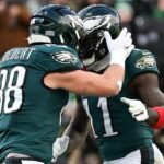 Philadelphia Eagles tight end Dallas Goedert (88) celebrates with wide receiver A.J. Brown (11) after scoring a touchdown against the Las Vegas Raiders during the first quarter at Lincoln Financial Field.