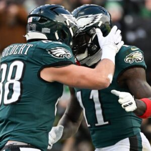 Philadelphia Eagles tight end Dallas Goedert (88) celebrates with wide receiver A.J. Brown (11) after scoring a touchdown against the Las Vegas Raiders during the first quarter at Lincoln Financial Field.