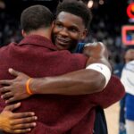 Minnesota Timberwolves guard Anthony Edwards (5) hugs Golden State Warriors guard Stephen Curry (30) after the game at the Chase Center.