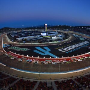 Nov 1, 2025; Avondale, Arizona, USA; NASCAR Xfinity Series driver Justin Allgaier (7) and driver Jesse Love (2) lead the restart during the Xfinity Series Championship race at Phoenix Raceway.