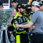Nov 5, 2023; Avondale, Arizona, USA; NASCAR Cup Series driver Ryan Blaney (left) is congratulated by Brad Keselowski as he celebrates after winning the 2023 NASCAR Cup Series Championship at Phoenix Raceway