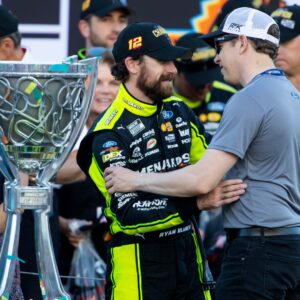 Nov 5, 2023; Avondale, Arizona, USA; NASCAR Cup Series driver Ryan Blaney (left) is congratulated by Brad Keselowski as he celebrates after winning the 2023 NASCAR Cup Series Championship at Phoenix Raceway