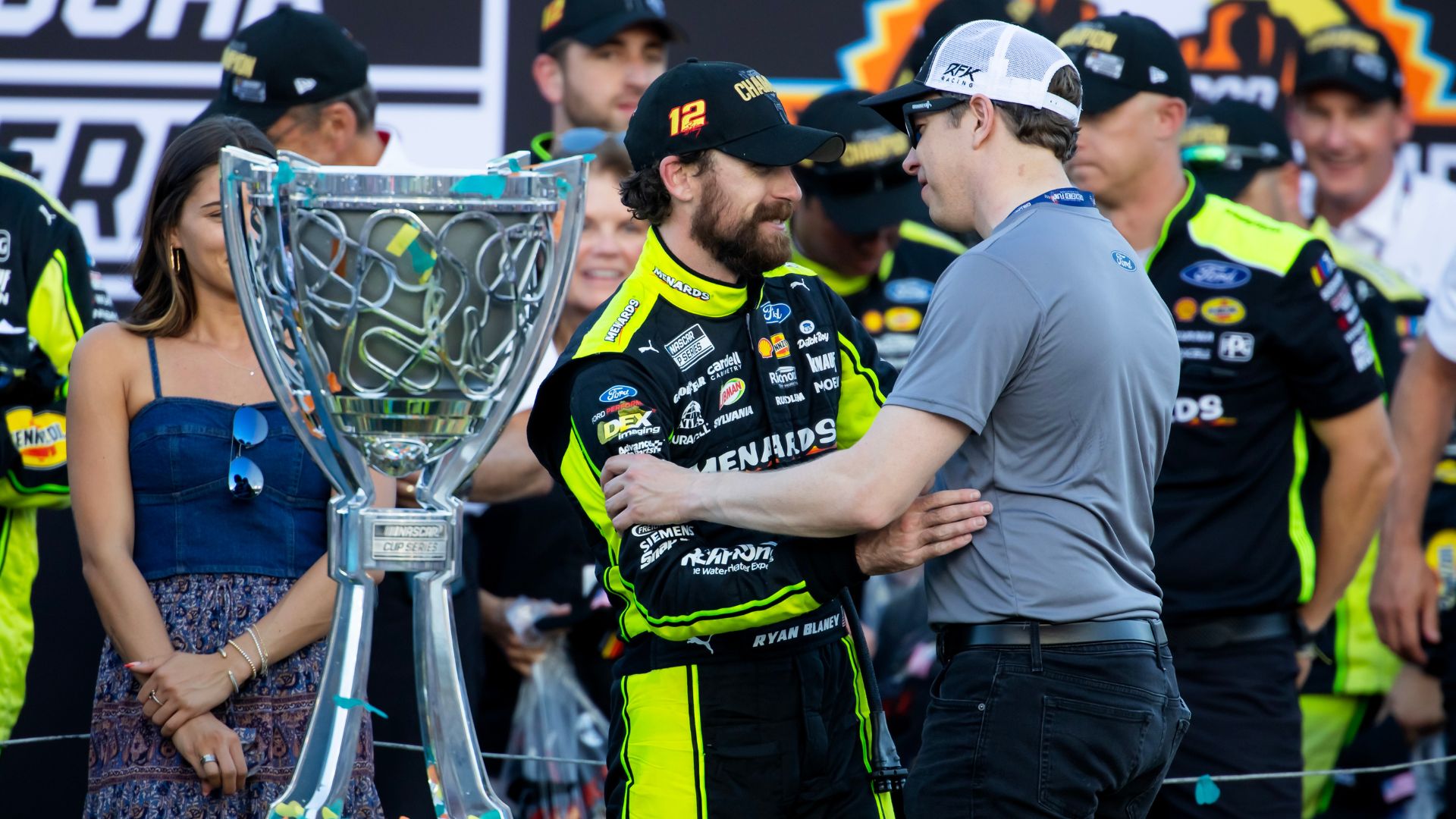 Nov 5, 2023; Avondale, Arizona, USA; NASCAR Cup Series driver Ryan Blaney (left) is congratulated by Brad Keselowski as he celebrates after winning the 2023 NASCAR Cup Series Championship at Phoenix Raceway