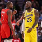 Houston Rockets forward Kevin Durant (7) talks with Los Angeles Lakers forward LeBron James (23) on the court during the second quarter at Toyota Center.