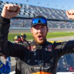 Feb 13, 2026; Daytona Beach, Florida, USA; NASCAR Truck Series driver Garrett Mitchell celebrates during qualifying for the Fresh from Florida 250 at Daytona International Speedway