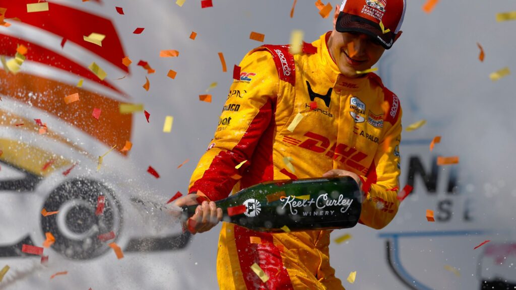 Mar 1, 2026; St. Petersburg, Florida, USA; Chip Ganassi Racing driver Alex Palou (10) sprays champagne after winning the NTT Indycar Series at the Firestone Grand Prix on the Streets of St. Petersburg.