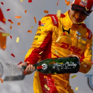 Mar 1, 2026; St. Petersburg, Florida, USA; Chip Ganassi Racing driver Alex Palou (10) sprays champagne after winning the NTT Indycar Series at the Firestone Grand Prix on the Streets of St. Petersburg.