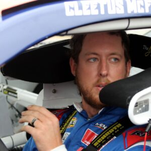 DAYTONA BEACH, FL - FEBRUARY 14: Garrett Mitchell ( 30 Kenetix Ford) aka YouTuber Cleetus McFarland sits in his car waiting for practice for the ARCA Menards Series Chilli s Ride the Dente 200 on February 14, 2025, at Daytona International Speedway in Daytona Beach, FL