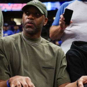 Apr 27, 2024; Orlando, Florida, USA; Orlando Magic former guard Tracy McGrady looks on from the sidelines during a game against the Cleveland Cavaliers in the fourth quarter during game four of the first round for the 2024 NBA playoffs at Kia Center.