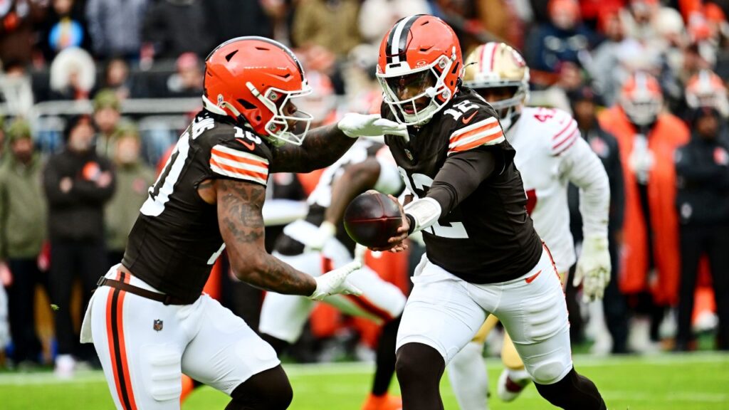 Cleveland Browns quarterback Shedeur Sanders (12) hands off the ball to Cleveland Browns running back Quinshon Judkins (10) during the first half against the San Francisco 49ers at Huntington Bank Field.