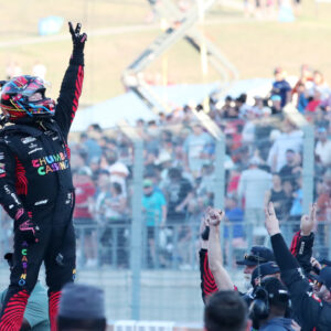 Mar 1, 2026; Austin, Texas, USA; NASCAR Cup Series driver Tyler Reddick (45) raises three fingers after his third win in a row at the NASCAR Cup Series Duramax Texas Grand Prix Powered by RelaDyne at Circuit of the Americas. Mandatory Credit: Michael C. Johnson-Imagn Images