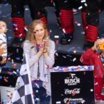 Alexa Reddick holding Rookie after Tyler Reddick's Daytona win