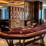 Upscale casino interior with elegant gaming table and sophisticated lighting design