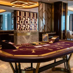 Upscale casino interior with elegant gaming table and sophisticated lighting design