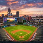 Progressive Field baseball stadium in Cleveland with downtown skyline at sunset