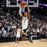 Victor Wembanyama dominates during Spurs playoff game with powerful dunk in white jersey