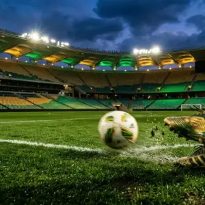 Floodlit stadium pitch with emerald-green and gold lighting, football boot in motion blur, match ball mid-roll, dramatic shadows.