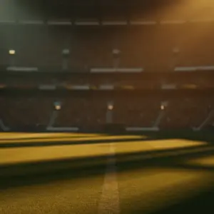 Empty floodlit stadium pitch at golden hour with dramatic shadows, packed stands in background, warm and cool colour contrast.