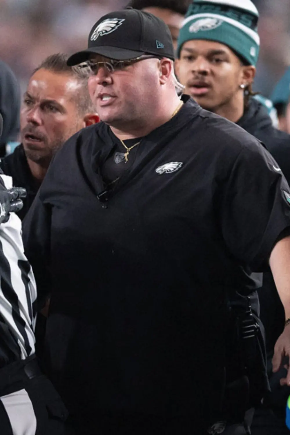 Dom DiSandro, Eagles personnel, interacting on the sidelines during a game.