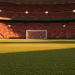 Floodlit football stadium pitch at golden-hour kick-off with national colour-lit stands, dramatic shadows, and cinematic lighting.