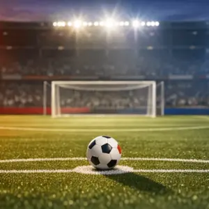 Empty floodlit football pitch at twilight with match ball on penalty spot, dramatic shadows, red and blue flag-colour lighting, stadium anticipation.