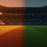 Floodlit stadium pitch at golden-hour kick-off, red-white and orange-blue colour zones, dramatic shadows, empty stands.