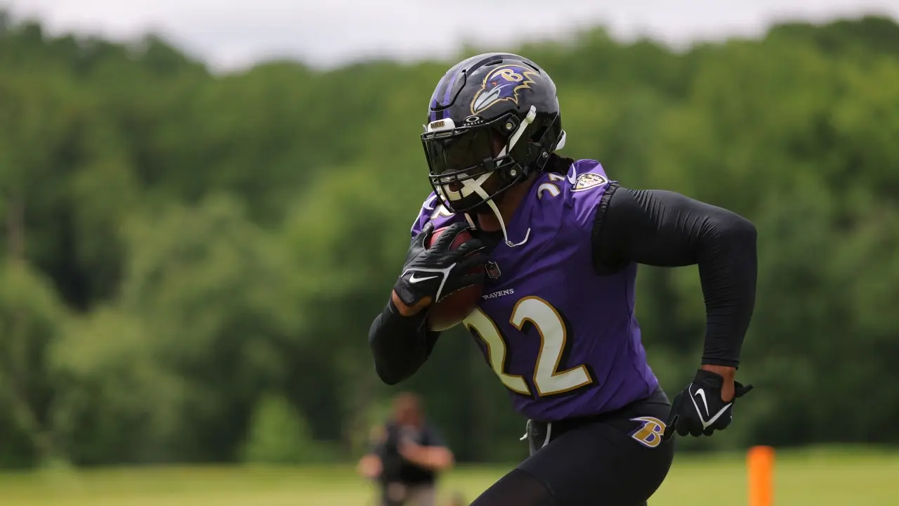 Baltimore Ravens running back Derrick Henry running with a football during practice
