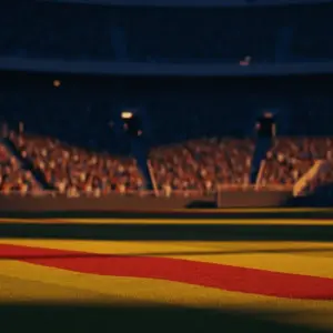 Floodlit stadium at golden hour with packed stands and dramatic shadow patterns during World Cup semi-final.