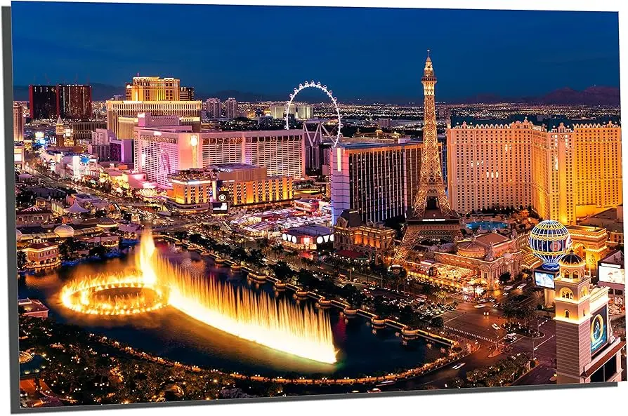 Vibrant Las Vegas skyline at night featuring the Eiffel Tower and fountains.