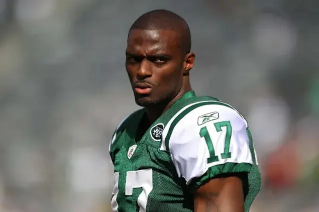 Plaxico Burress wearing a green and white New York Jets jersey with number 17