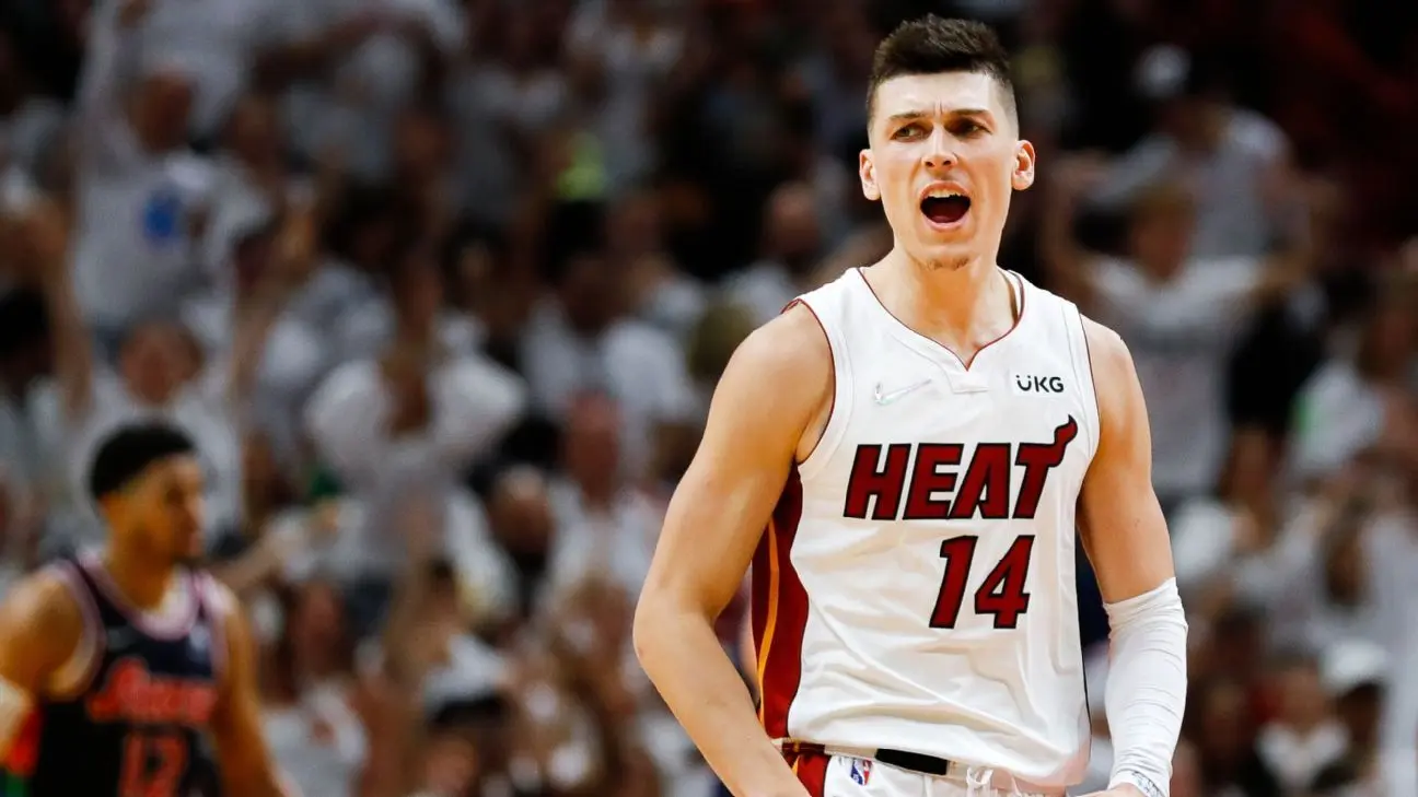 Tyler Herro of the Miami Heat celebrating during a game.