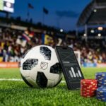 Soccer ball and betting chips on MLS stadium turf with a phone showing sportsbook interface