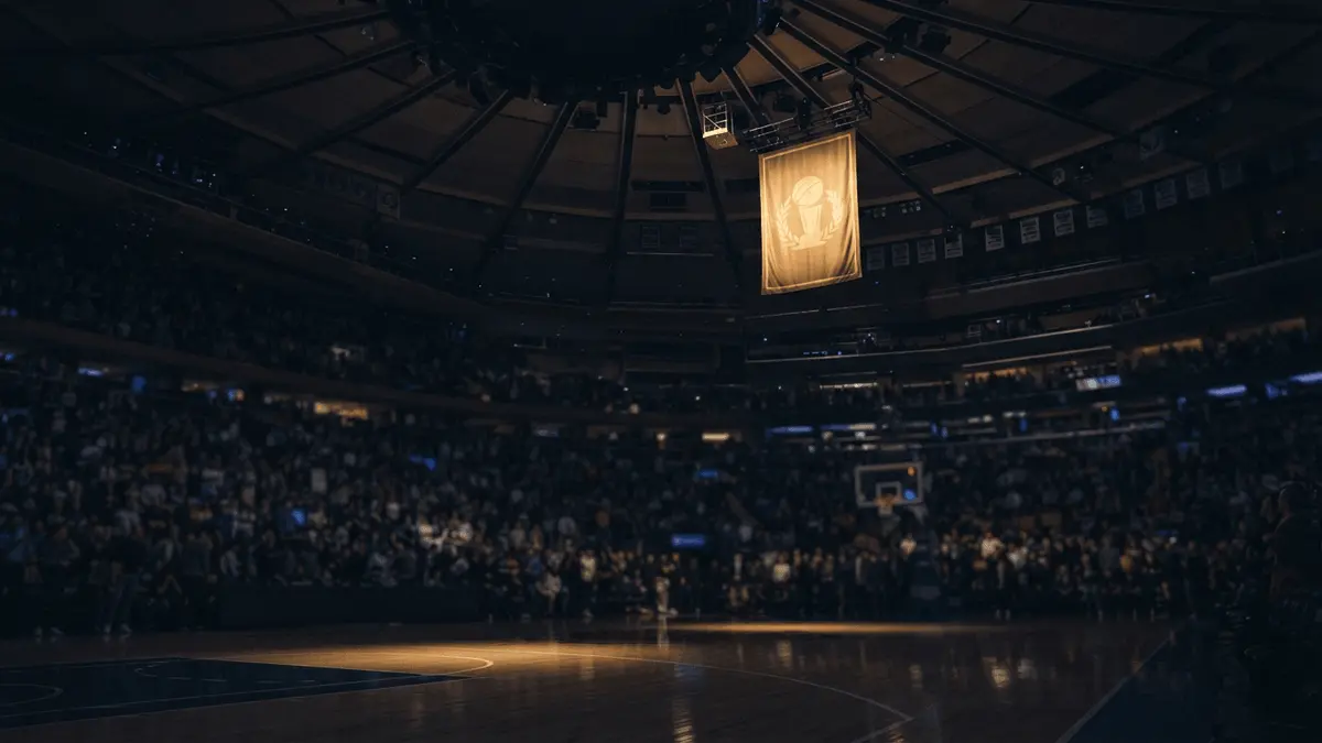 Championship banner rising above the court at Madison Square Garden during an NBA opening-night ceremony