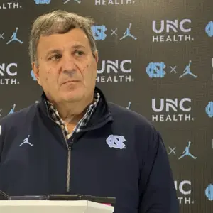Promotional graphic of Bill Belichick as the North Carolina Tar Heels football head coach